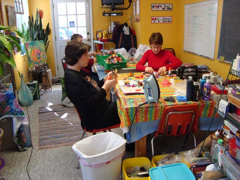 A group of women doing crafts at a table