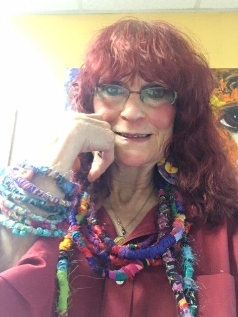 Me wearing hand made jewelry that I create with recycled materials